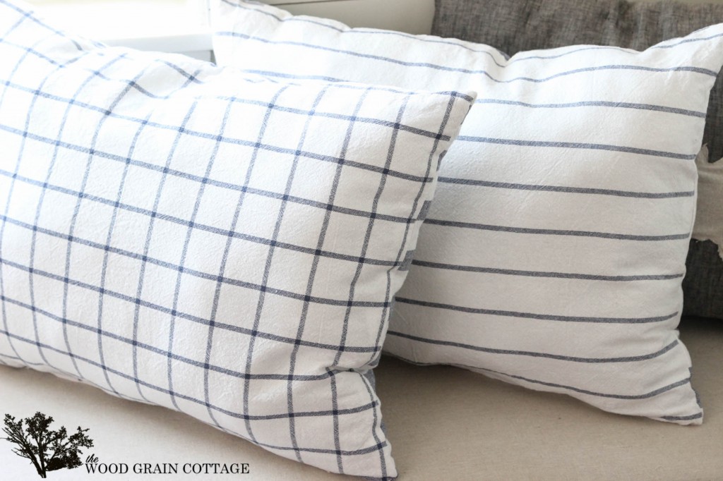 Use kitchen tea towels to make your own pillows! Full tutorial by The Wood Grain Cottage