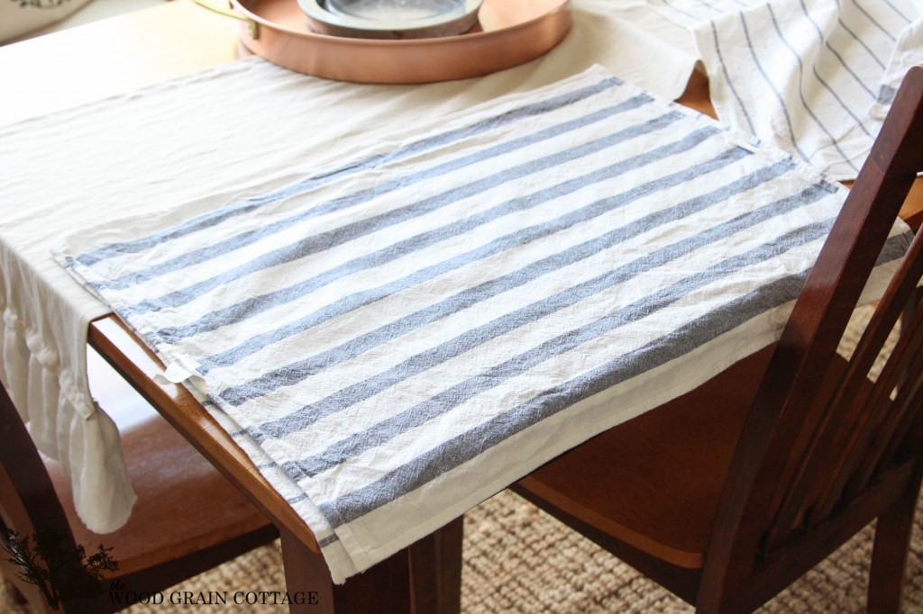 Use kitchen tea towels to make your own pillows! Full tutorial by The Wood Grain Cottage