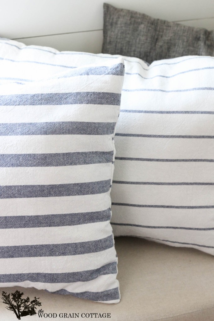 Use kitchen tea towels to make your own pillows! Full tutorial by The Wood Grain Cottage