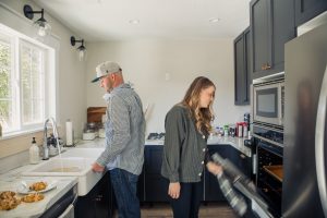 A picture of Todd and Shayna in their kitchen.