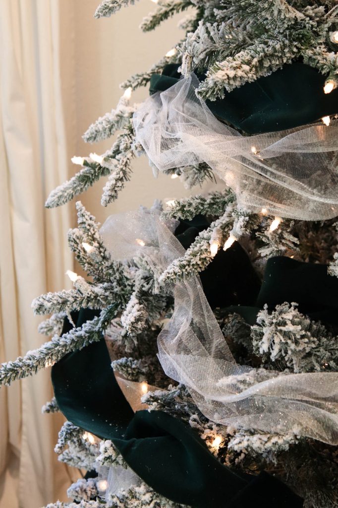 A close up picture of a flocked tree showing the two garlands. 