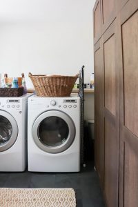 A picture of a laundry room with a washer and dryer.
