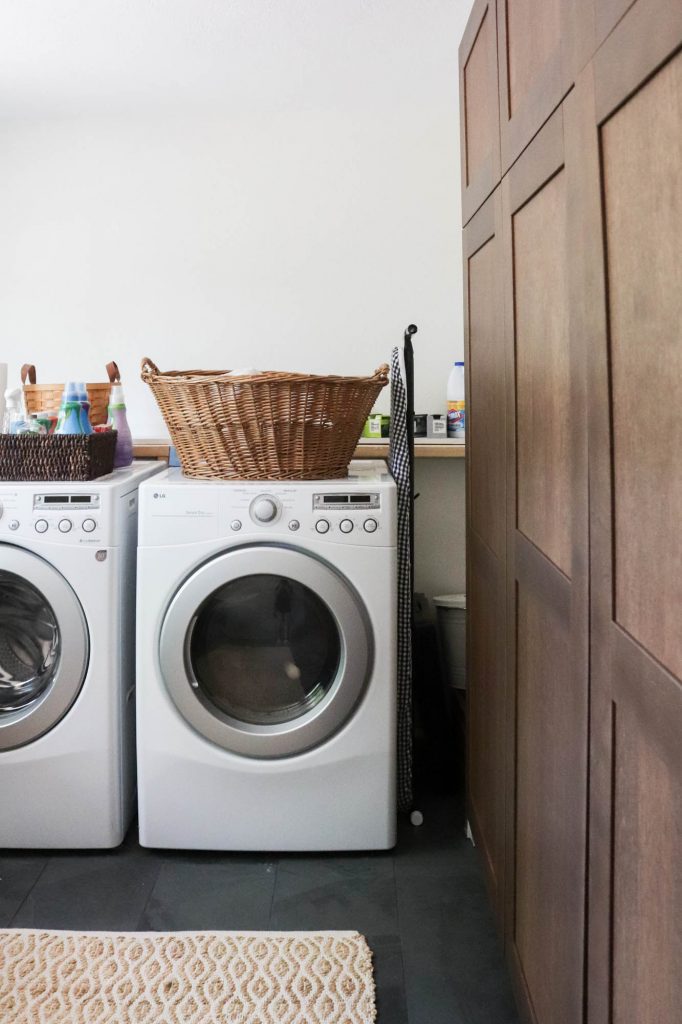 A picture of a laundry room with a washer and dryer. 