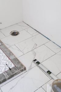 A picture of the bathroom floors tiled.