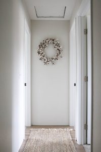 A picture of a hallway after installing and painting the interior doors.