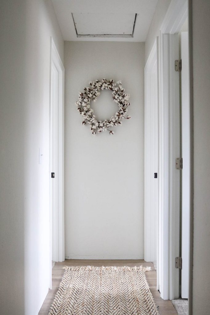 A picture of a hallway after installing and painting the interior doors. 