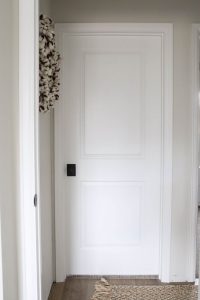 A picture of an interior door installed and painted.