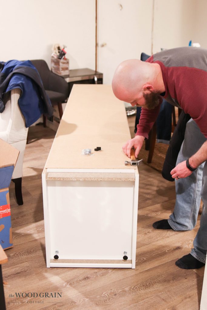 A picture of Todd building the Ikea Pax cabinet.