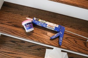 A picture showing spackling and caulking tools.