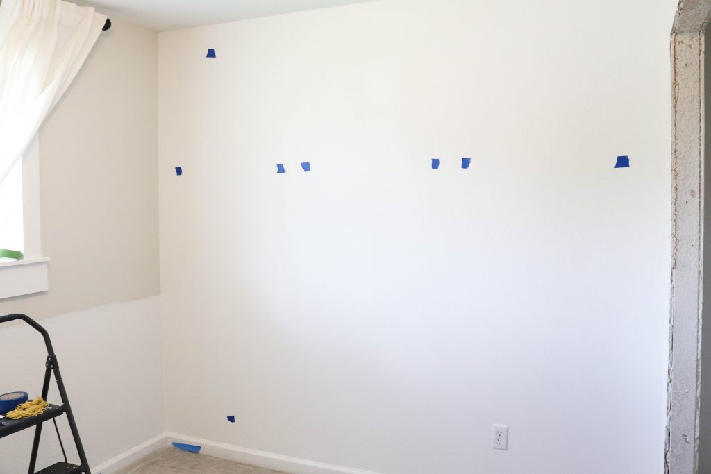 A picture of the wall with tape. 