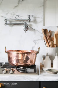 A picture of the copper jam pan on the range.