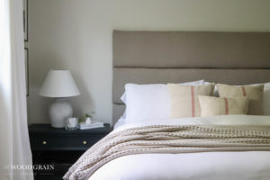 A picture of our master bedroom headboard and our nightstand.