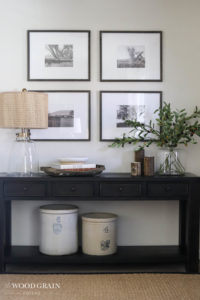 A picture showing frames with digital prints in our entryway.