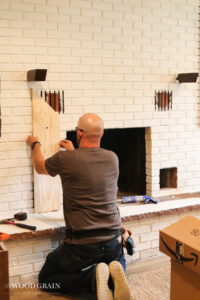 A picture of Todd installing the first trim board.