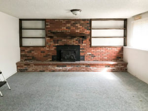 A picture of the brick fireplace before.